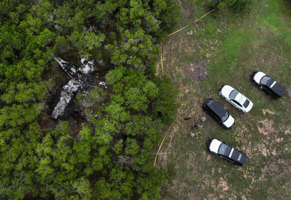 A crashed Cessna airplane is seen in a wooded area on Round Rock Road in Wimberley, Texas,...