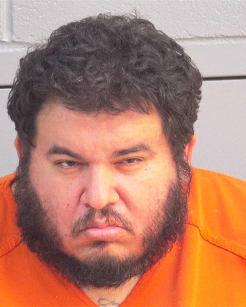 A man was arrested after threatening neighbors with a hatchet at the Santa Fe Apartments.